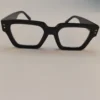 Black square frame eyeglasses with clear lenses